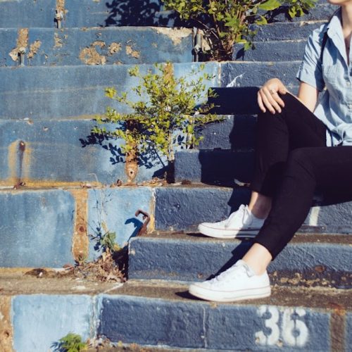 woman sitting on stairs