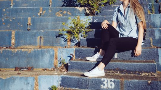 woman sitting on stairs
