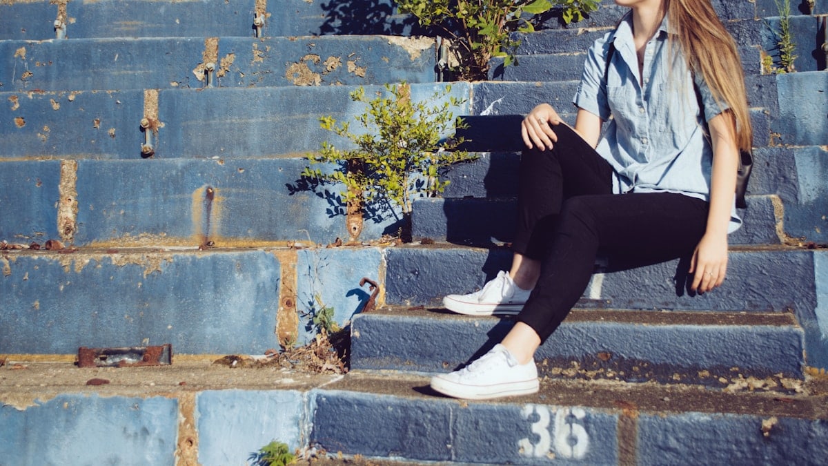 woman sitting on stairs